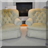 F31. Pair of tufted arm chairs. 